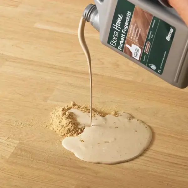 la pose de finition parquet, barre de seuil et plinthes